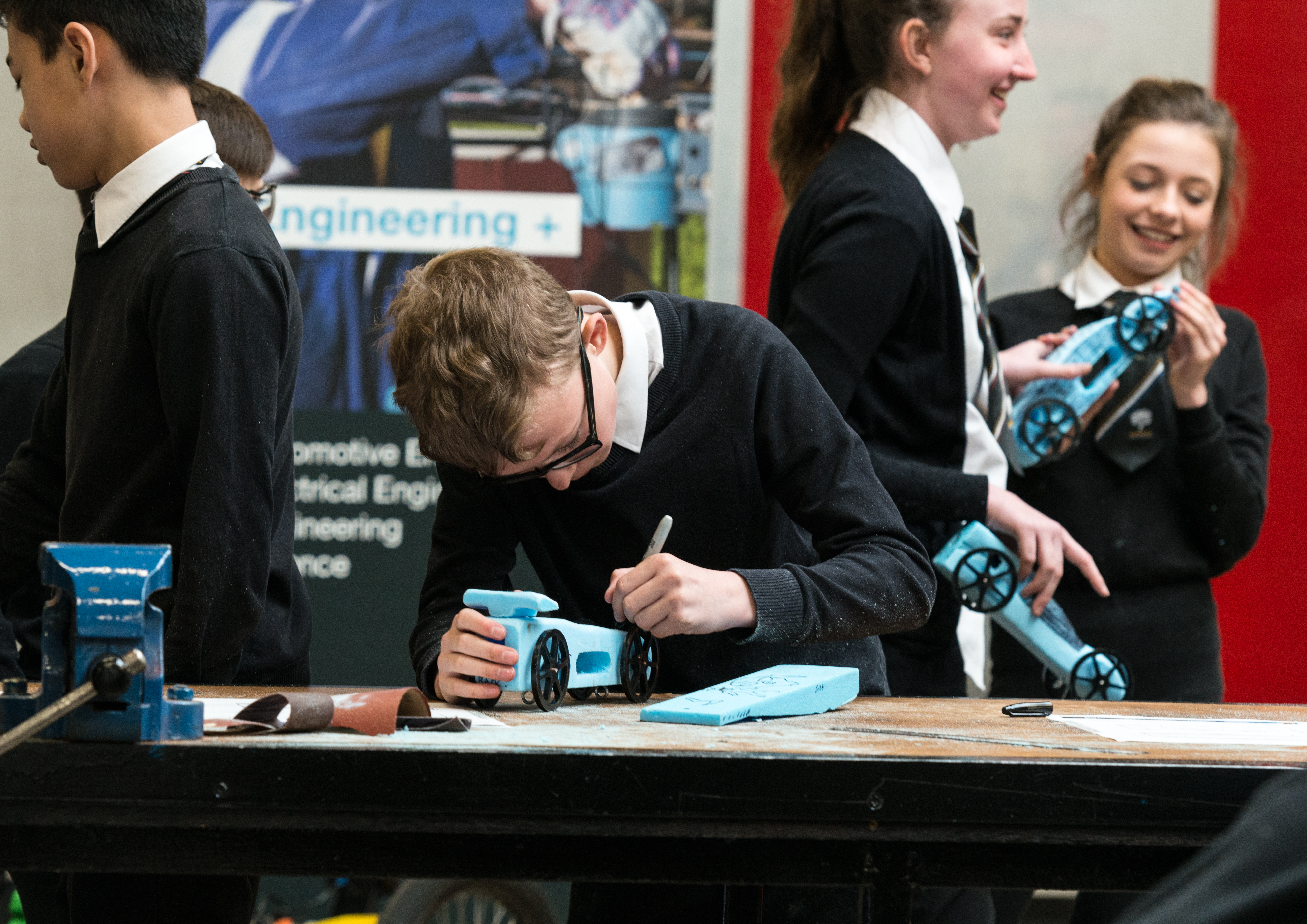 Schoolkids using BBC micro:bit on rocket car