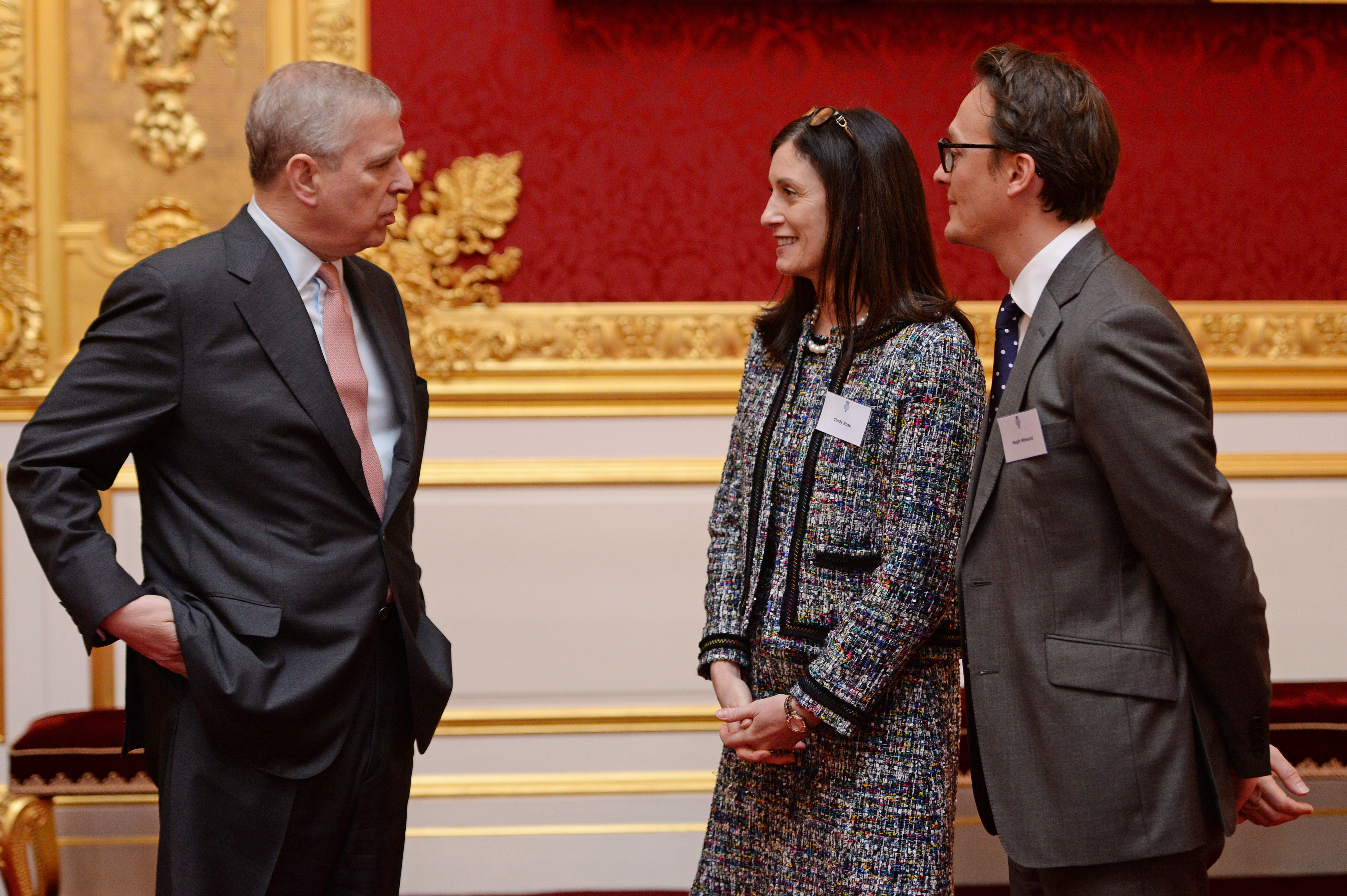 The Duke of York talks with Cindy Rose and Hugh Milward of Microsoft, supporters of the Inspiring Digital Enterprise Award, also known as the IDEA award, at St James' Palace, London.