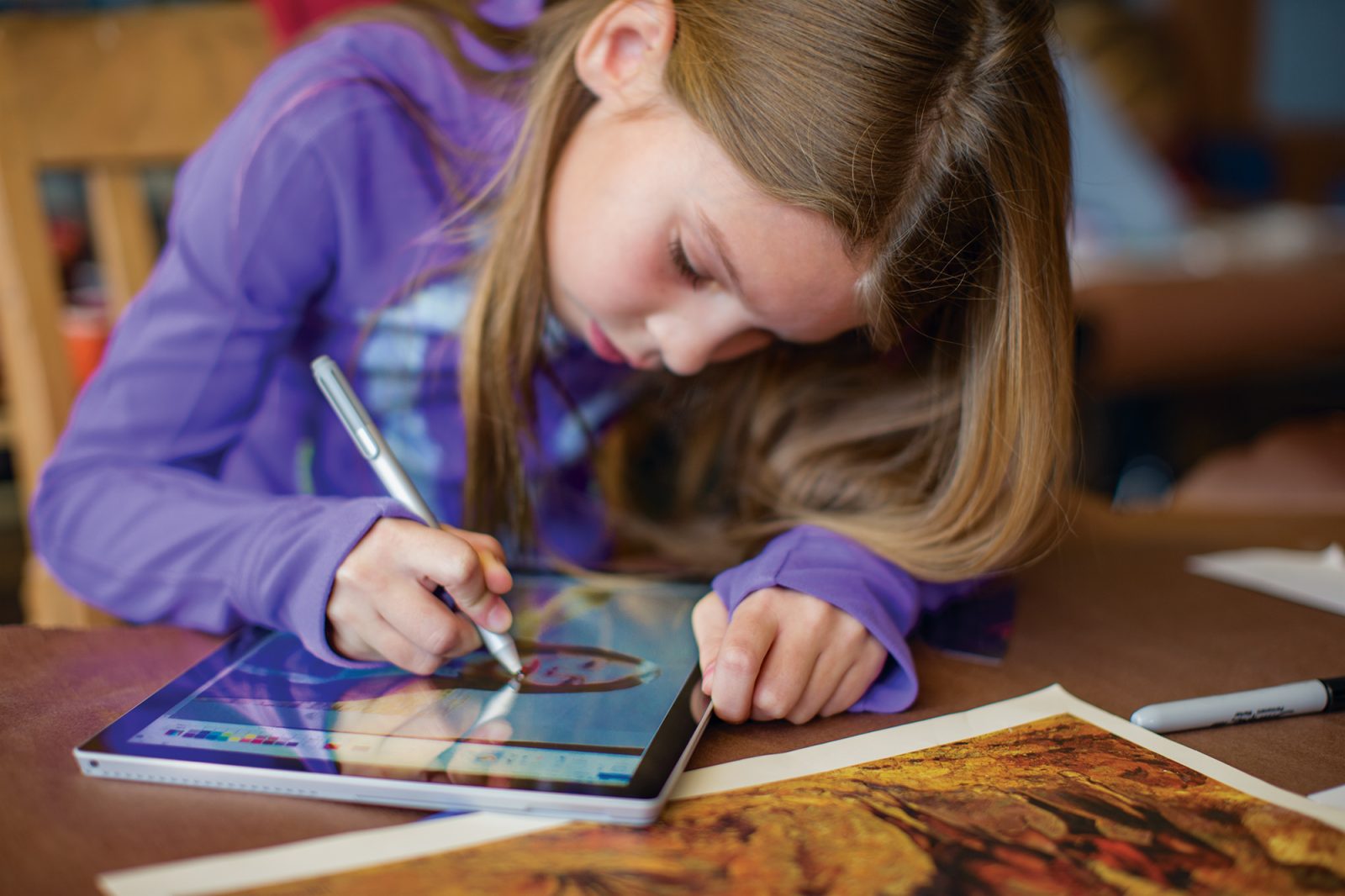 Girl drawing on a Surface Pro 4 in classroom