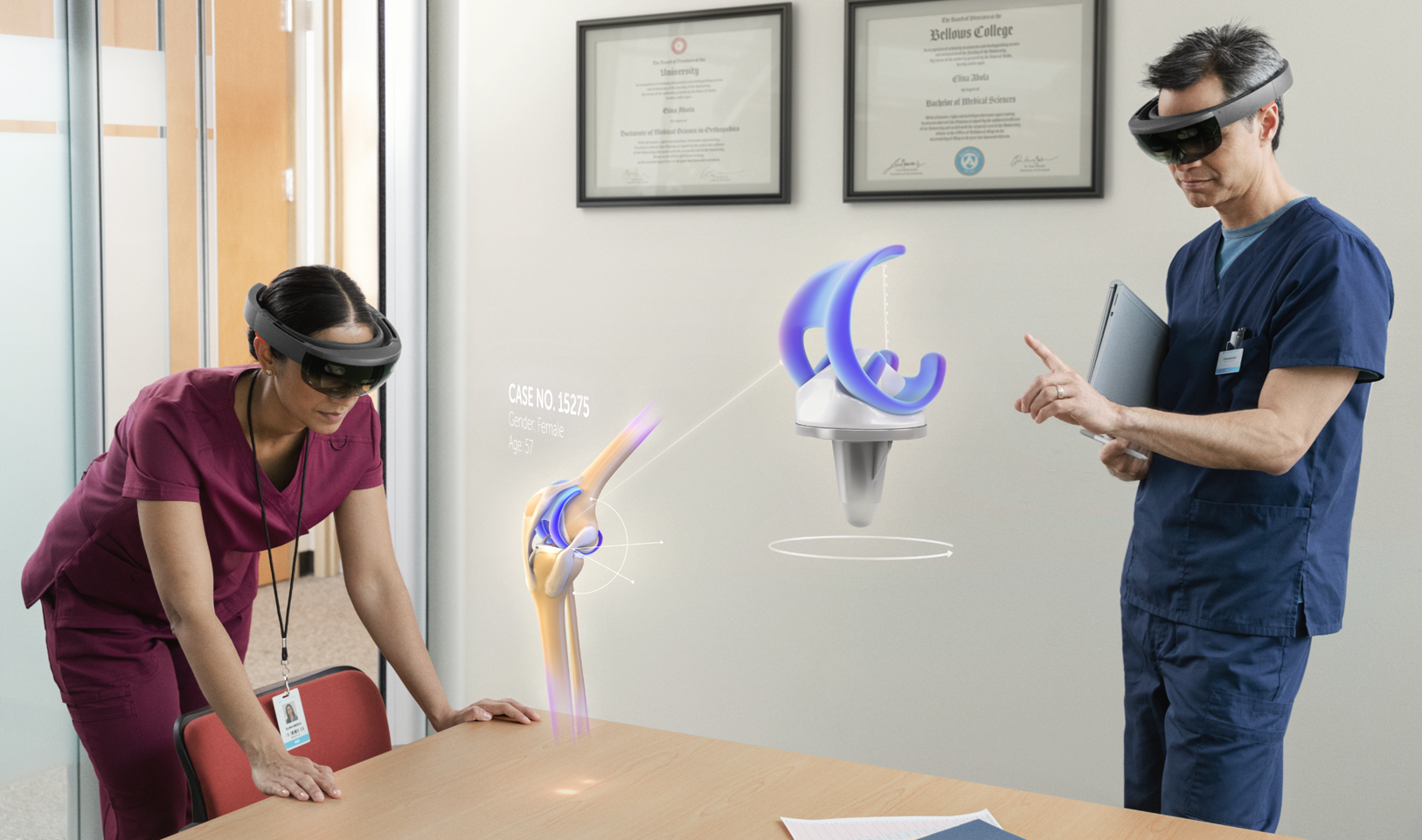 Two doctors using HoloLens to look at hologram of knee joint