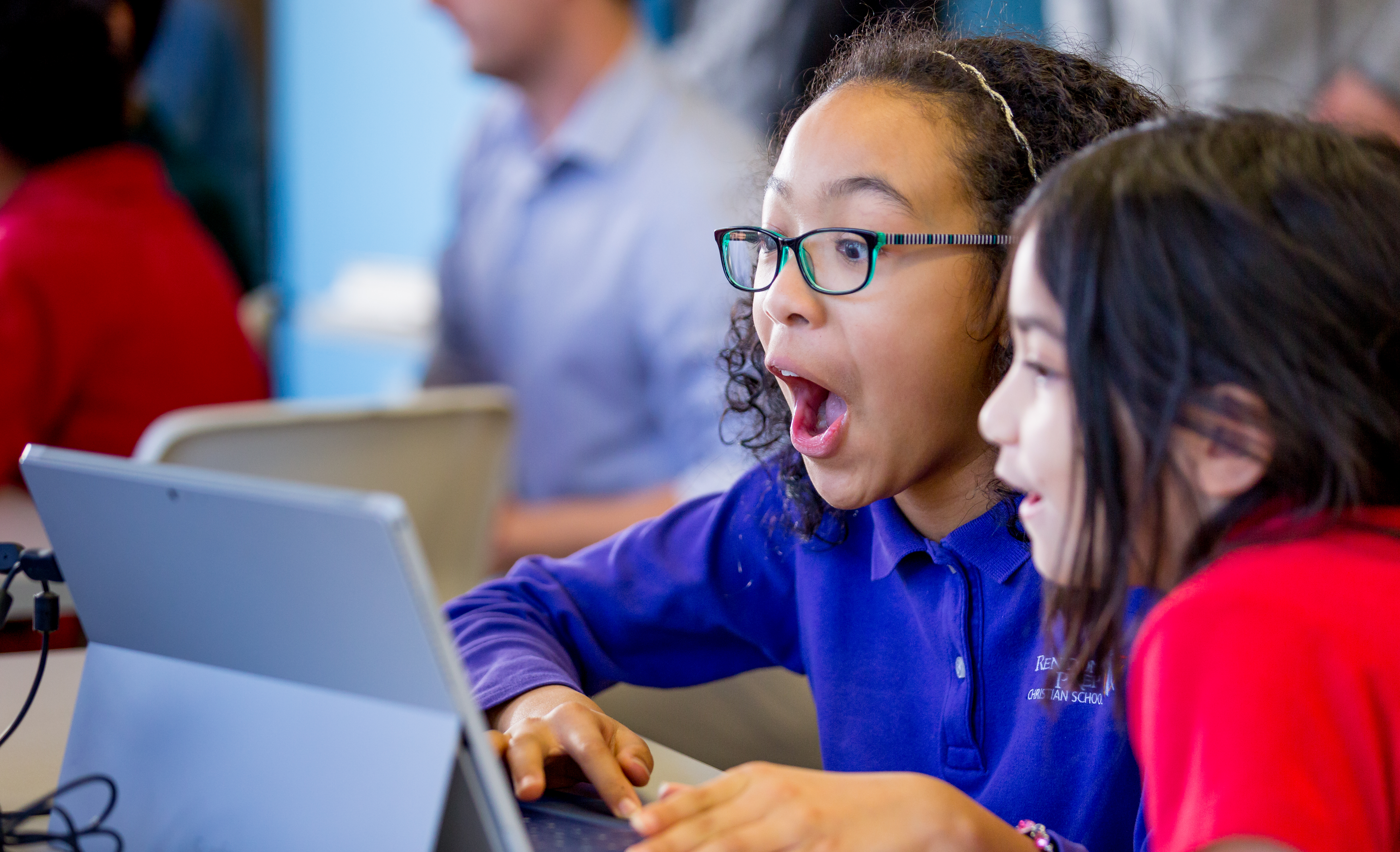 Schoolgirls using Microsoft Surface device