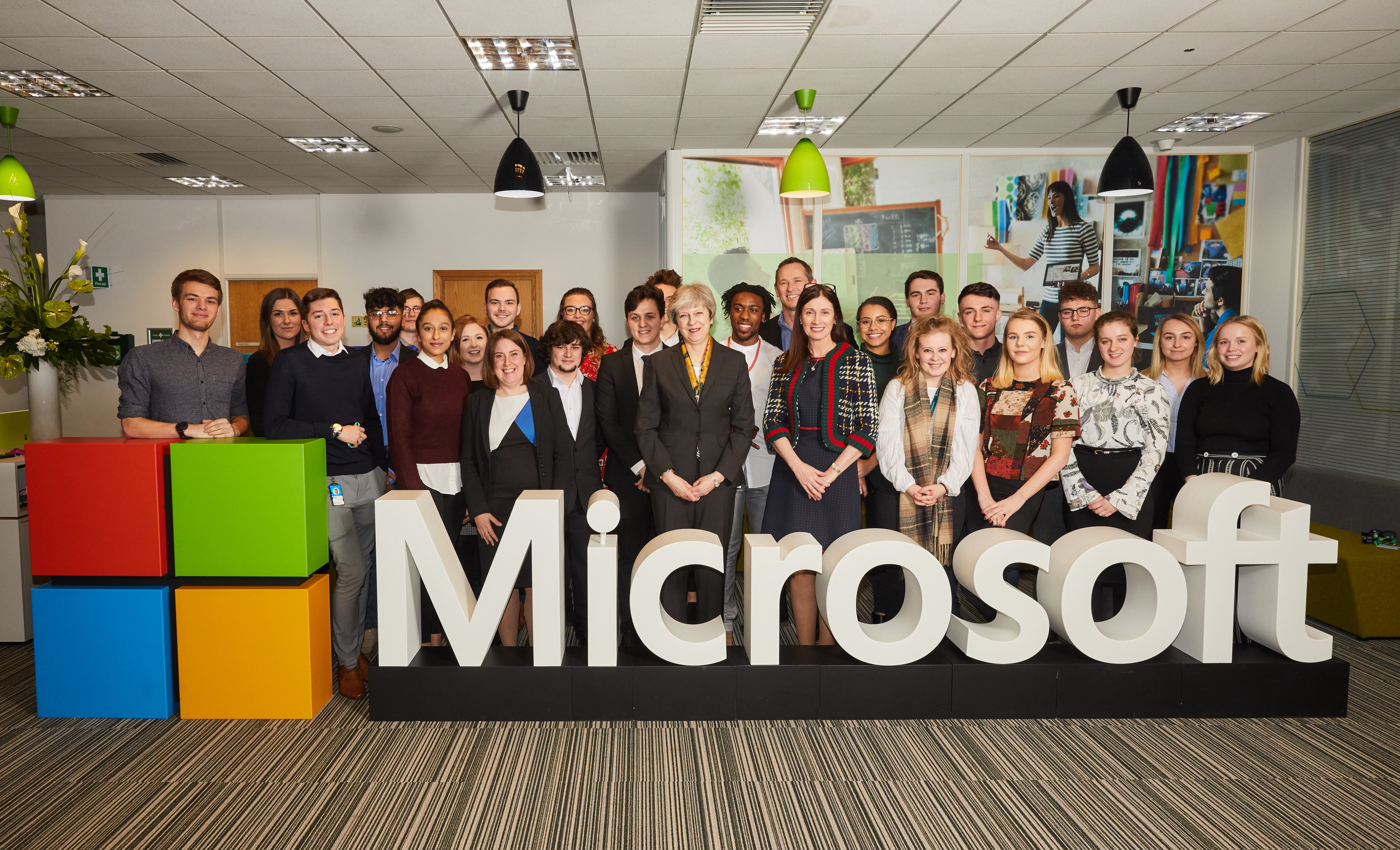 Prime Minister Theresa May and Cindy Rose, Chief Executive of Microsoft UK, with Microsoft apprentices