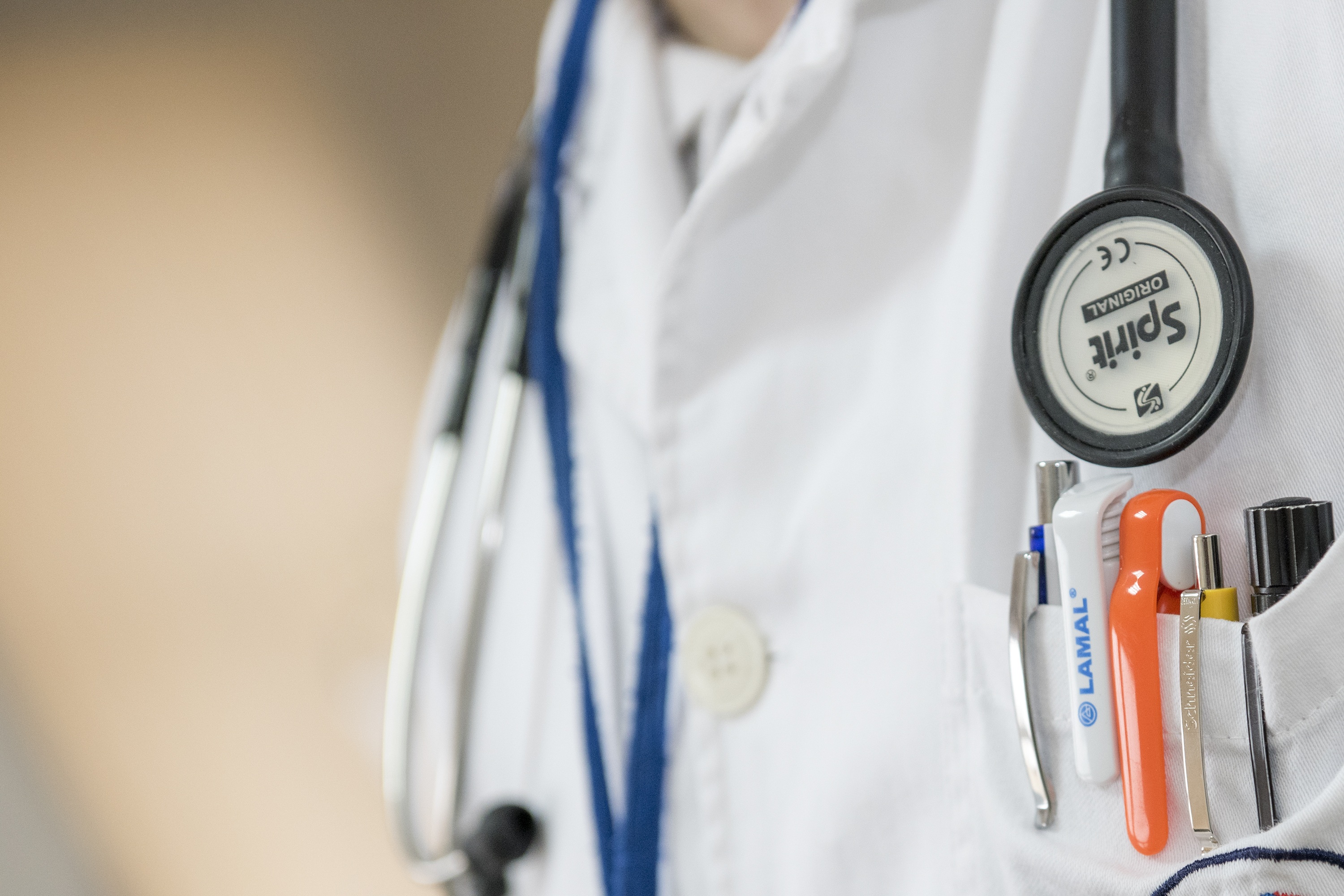 Torso of Doctor, wearing stethoscope around neck