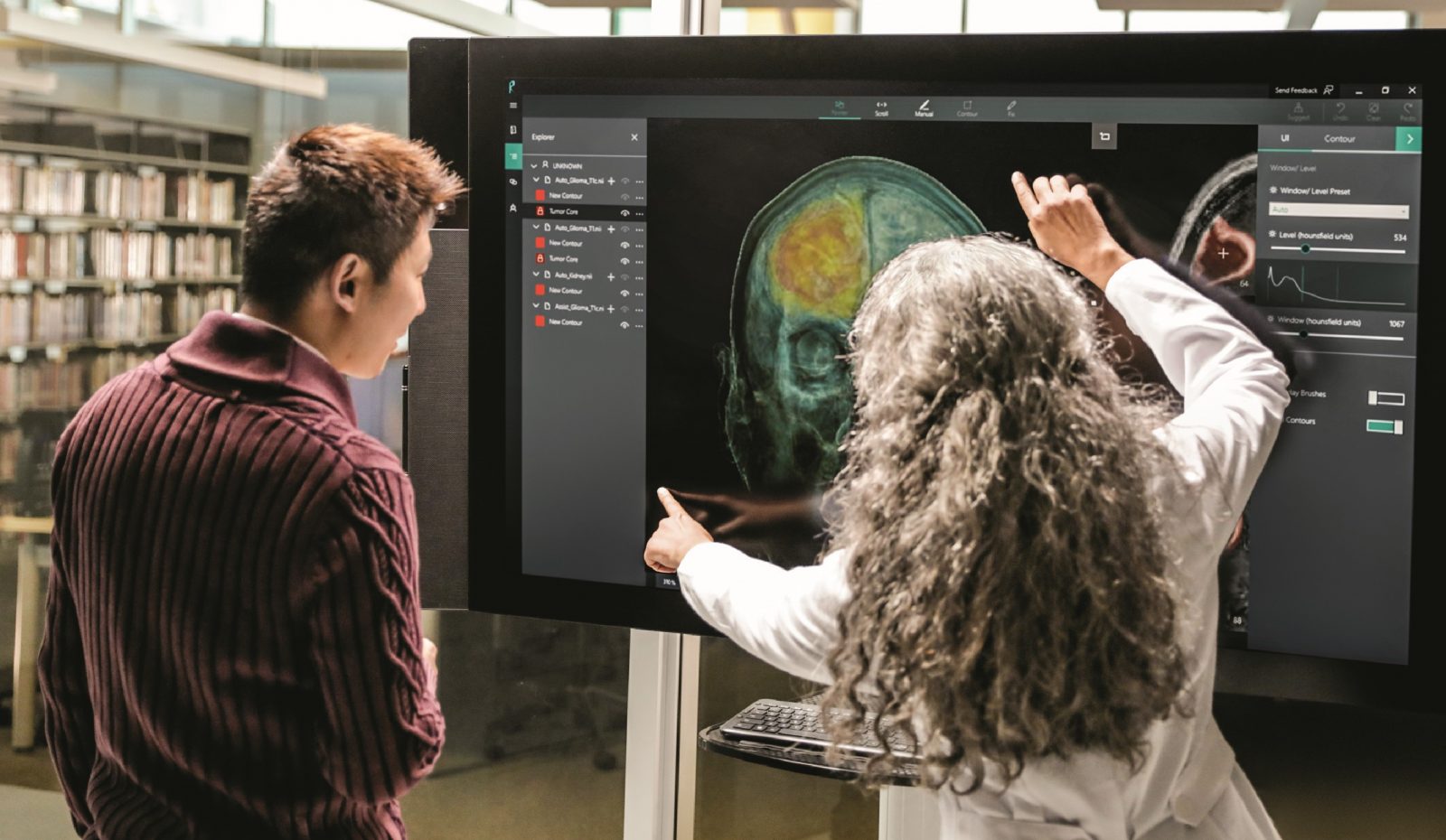 Woman and man use InnerEye project on Surface Studio