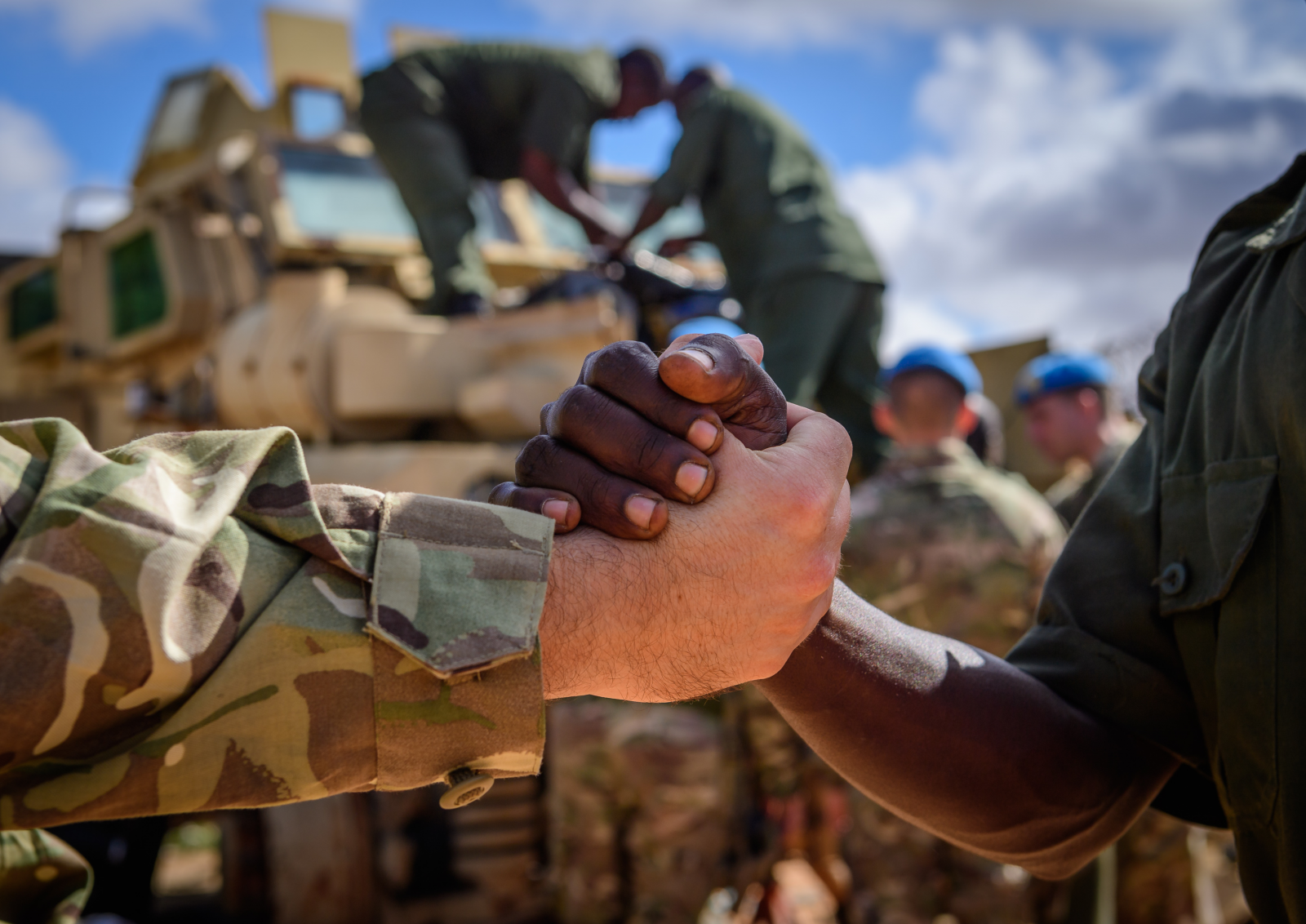 Close-up of Army soldiers haking hands