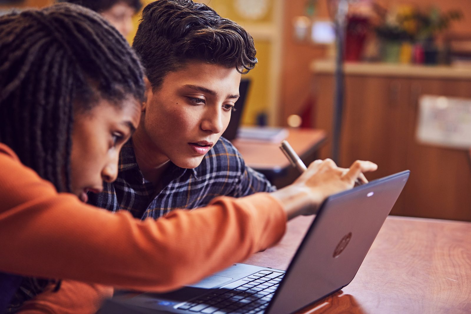 Teacher and student working on Surface device