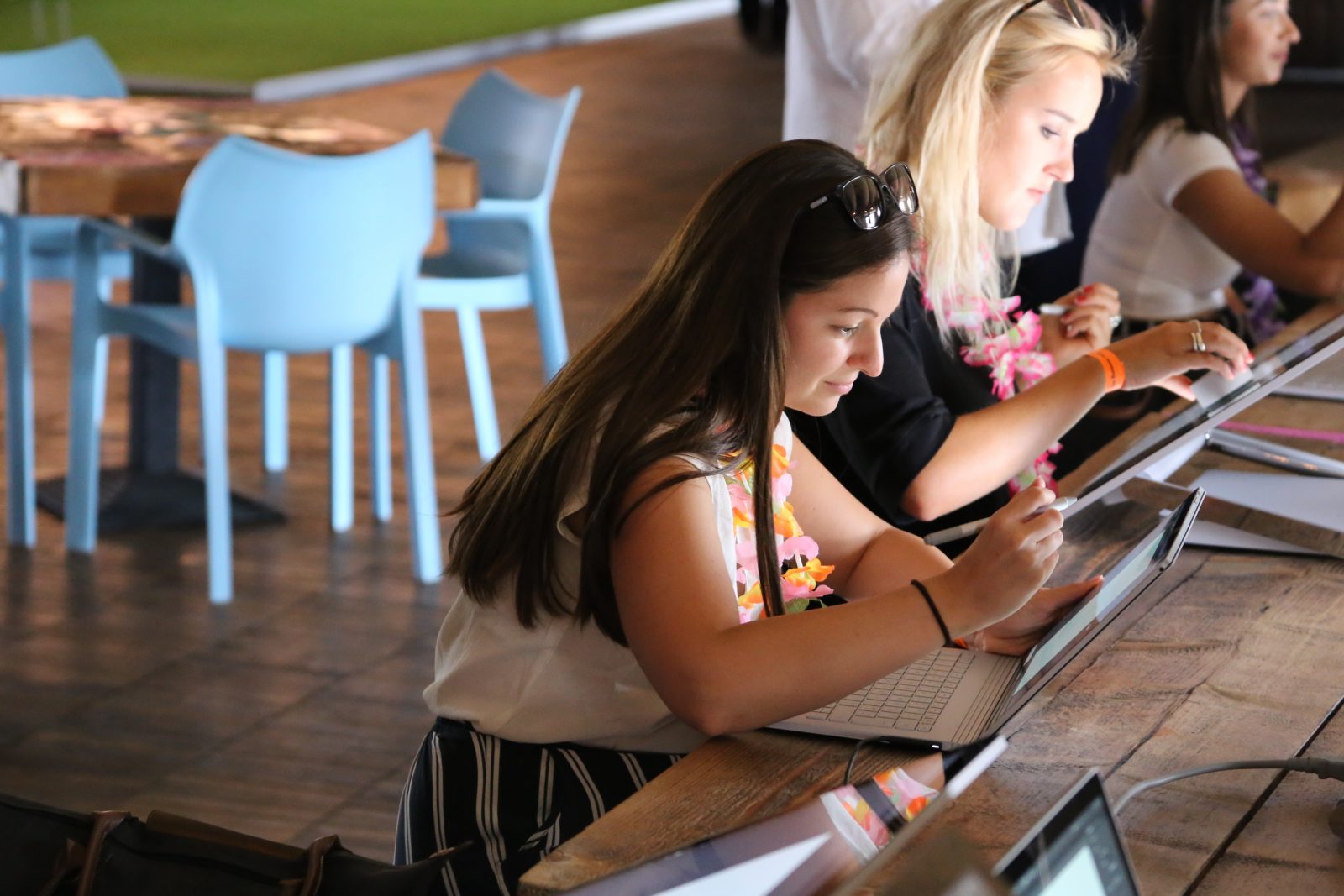 Woman using Surface laptop at table