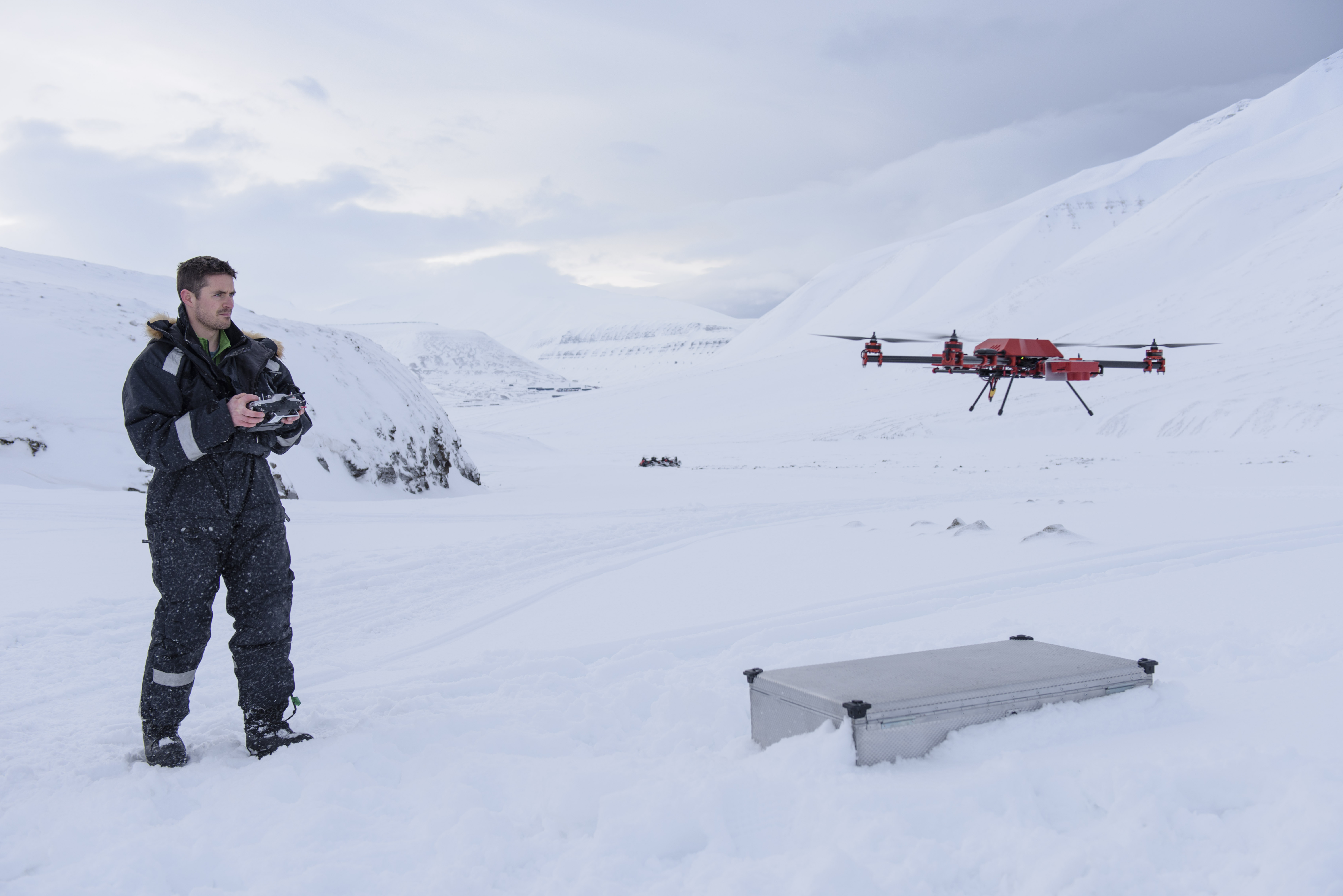 Scientist Joseph Cook flies a drone in the Arctic