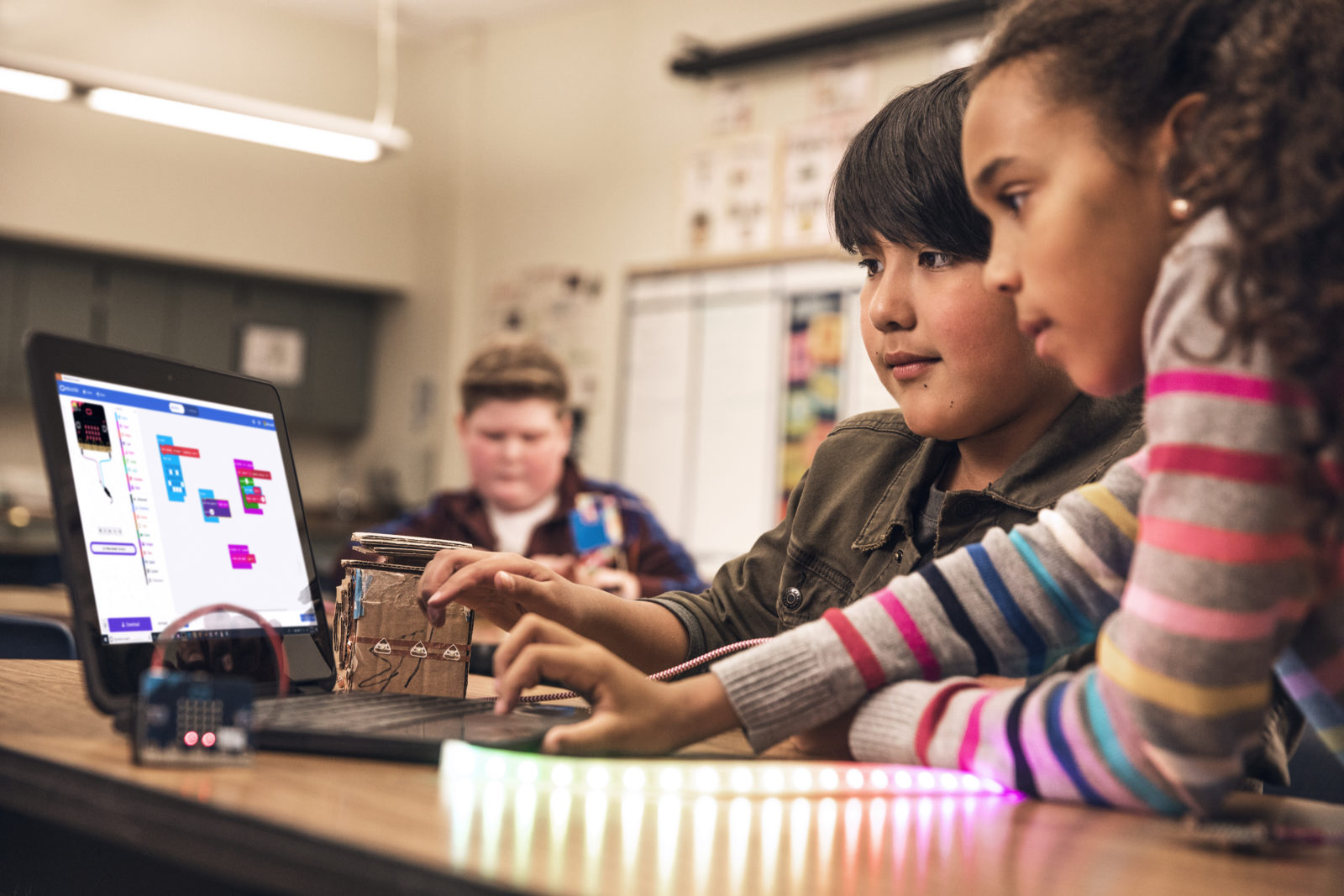 A female student and male student working together using micro:bit. STEM.