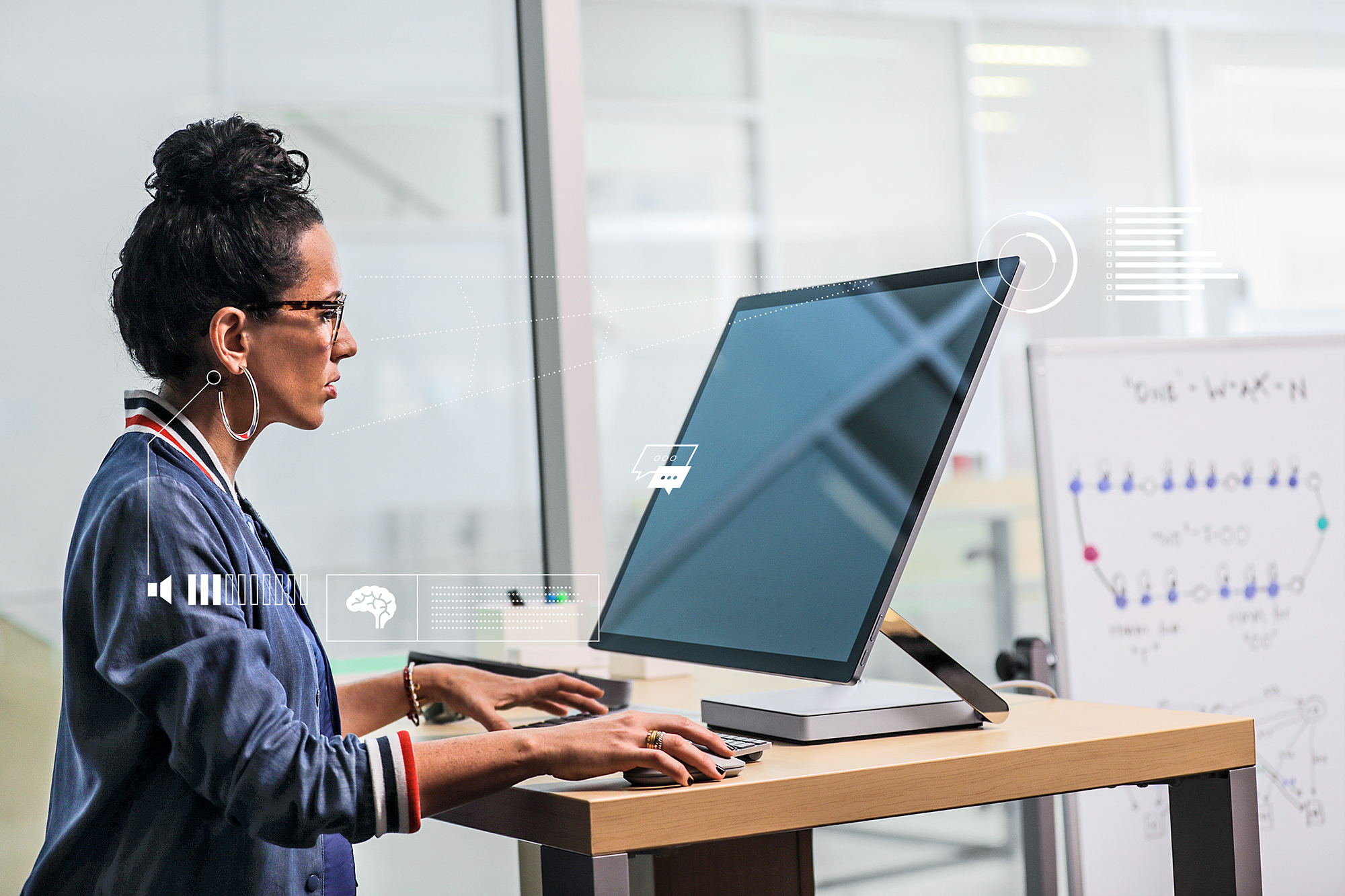 Woman using Surface Studio at work