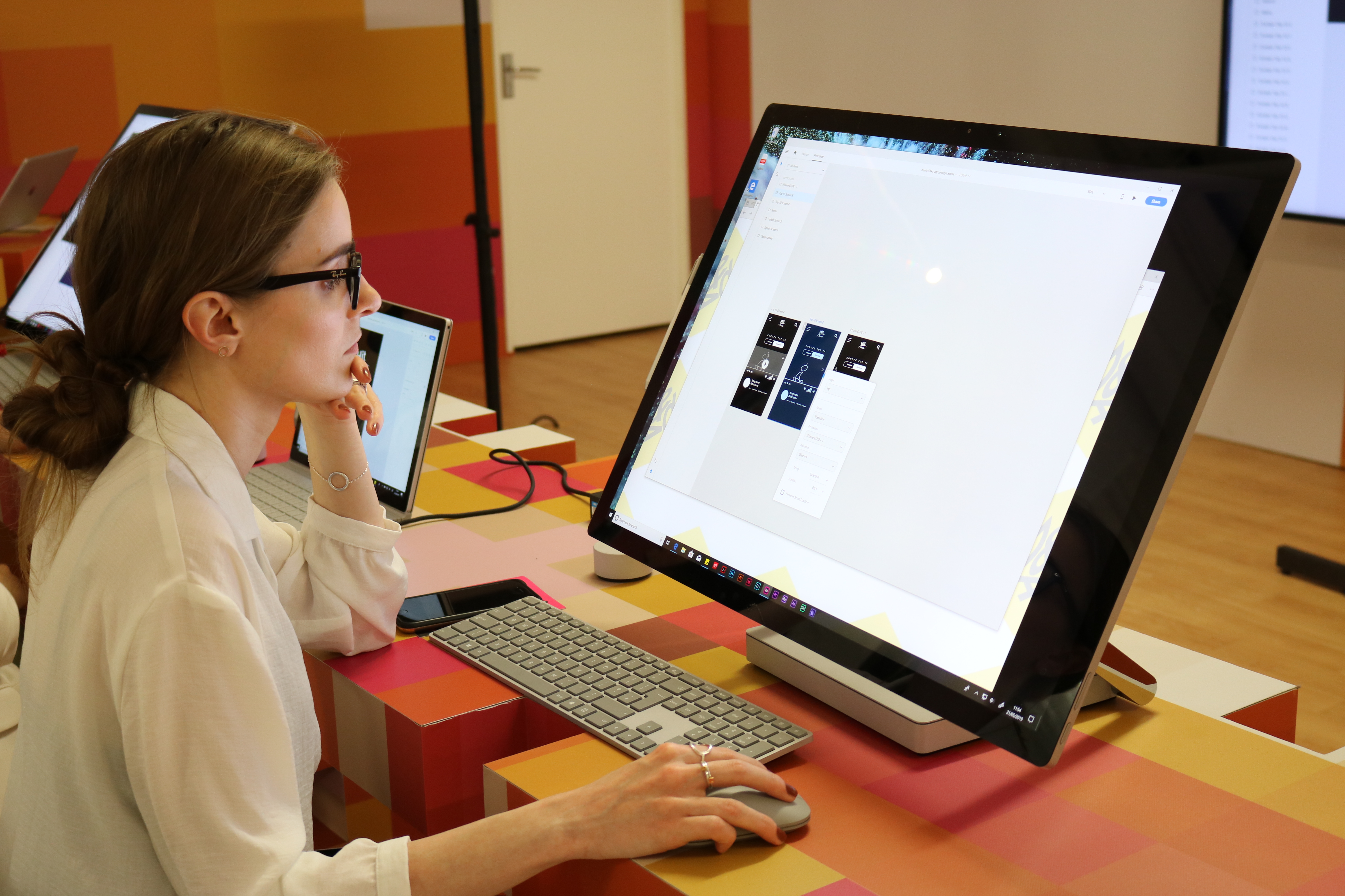 A girl uses a Surface Studio at D&AD