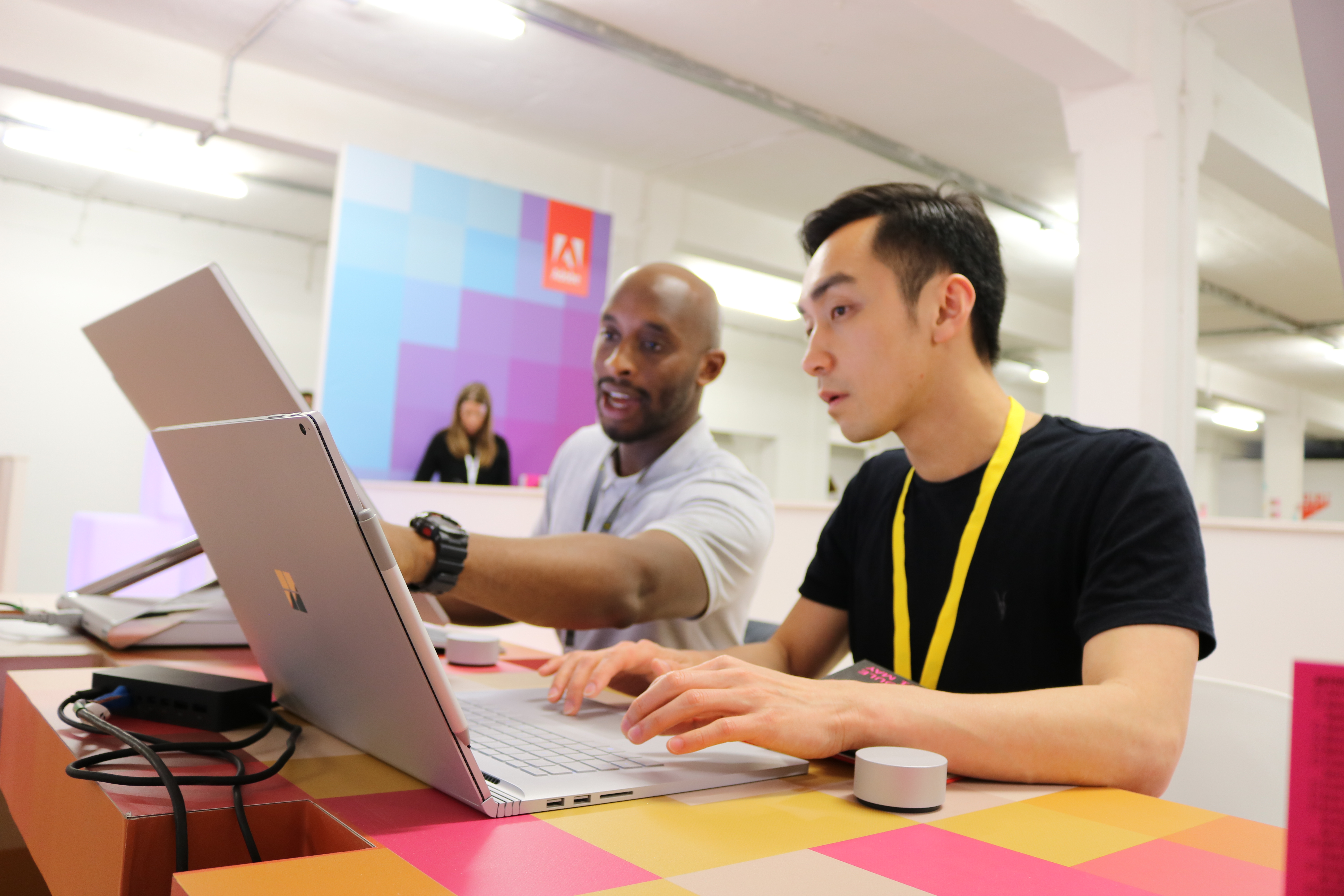 two men use a Surface Book at D&AD