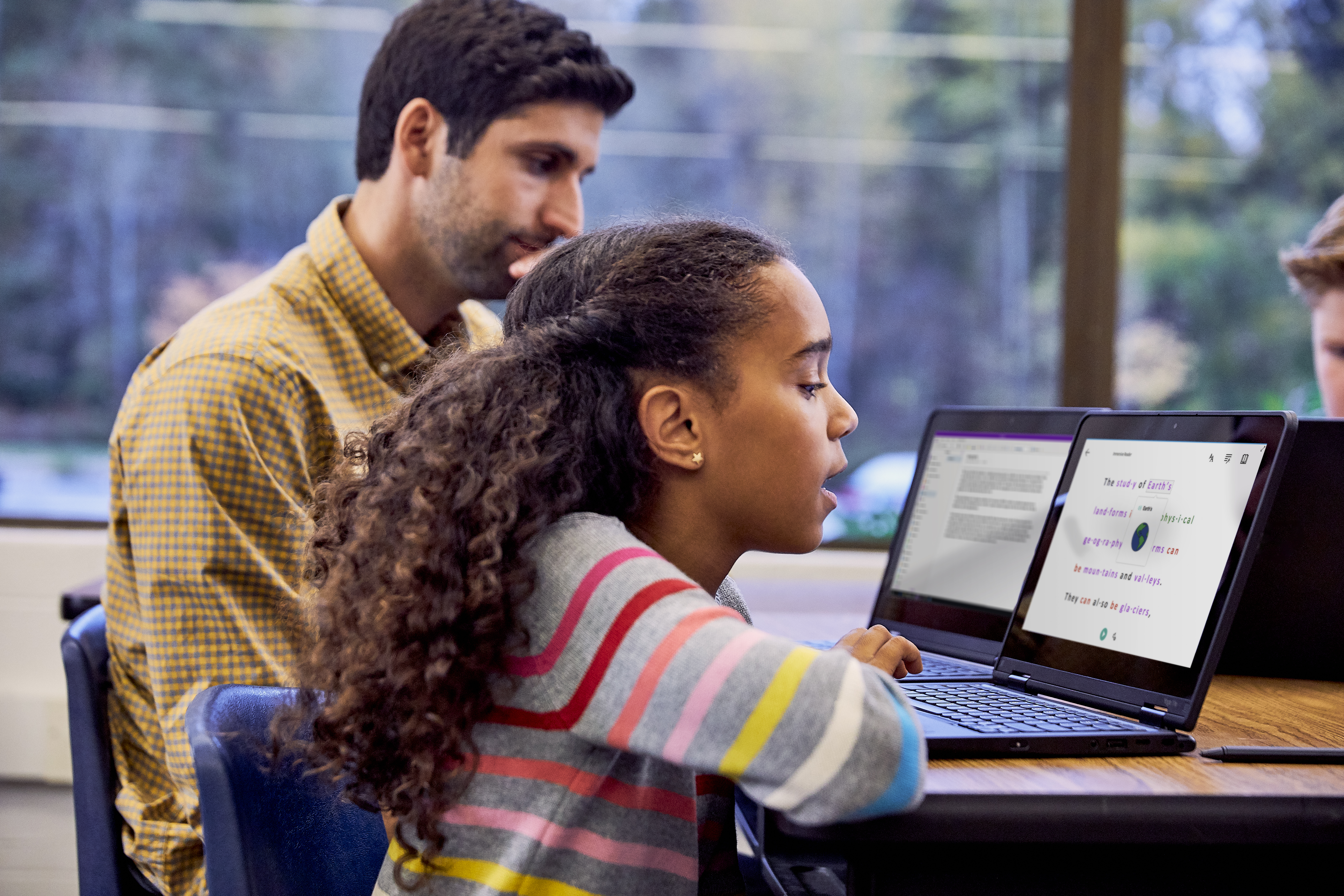 Girl using Immersive Reader in school classroom