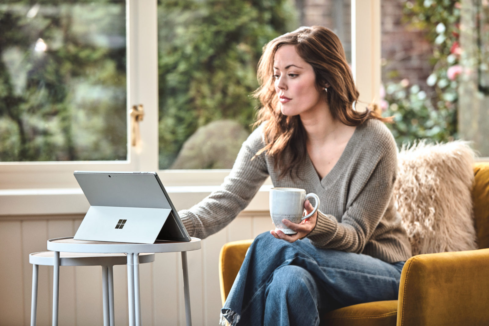 Woman using a Surface device at home
