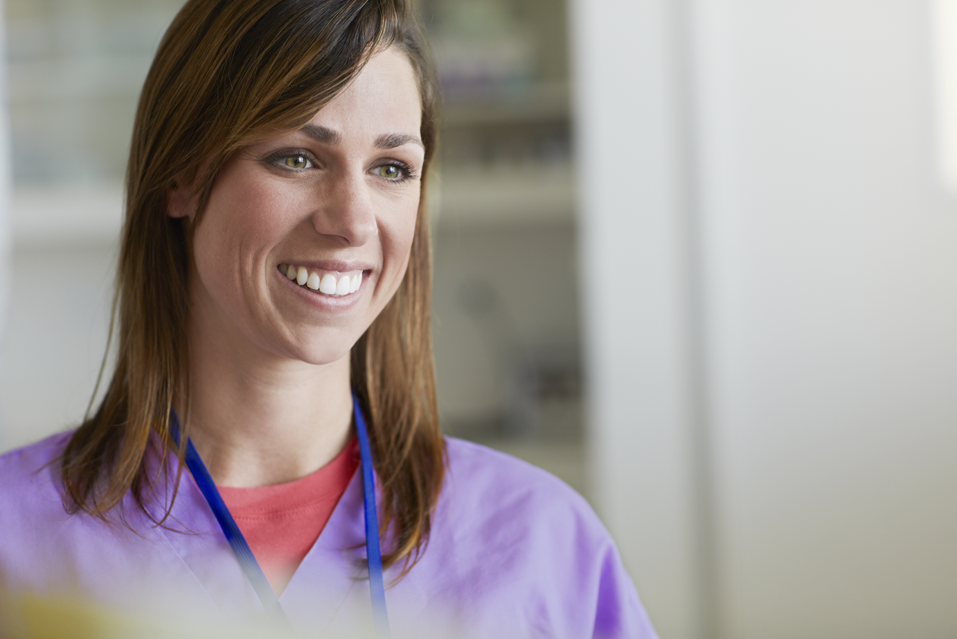 A nurse smiling in a hospital