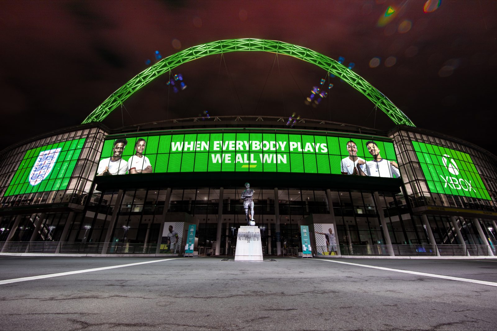 The entrance to Wembley Stadium is lit up in green to mark the new partnership between the FA and Xbox