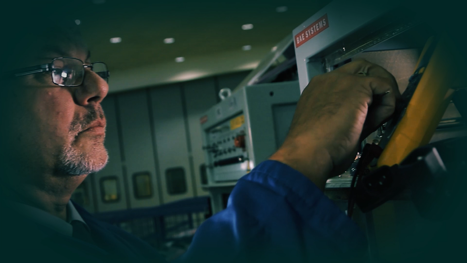 A BAE technician updating equipment