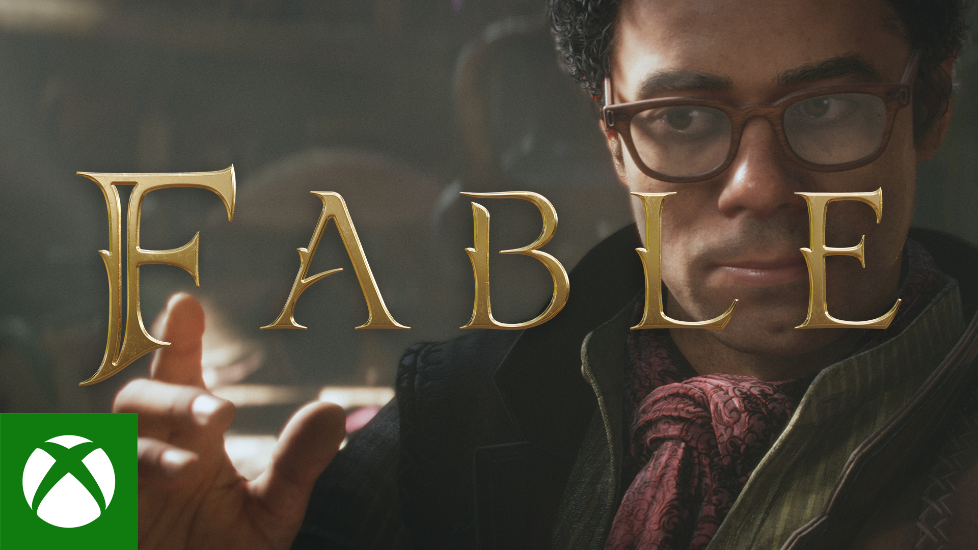 The feature image for the game Fable. The letters for Fable are spelt out in golden capital letters, with a man standing behind with his hand raised, looking pensively at his hand. He is wearing a cravat and is clean shaven with a pair of glasses.