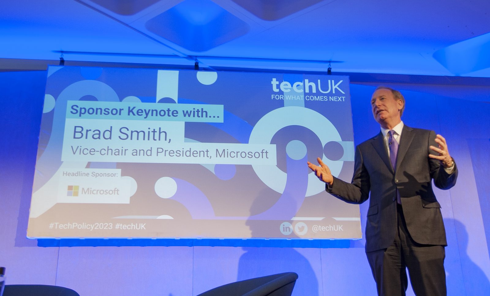 Microsoft President, Brad Smith, onstage at the techUK second annual Tech Policy Leadership Conference, giving a keynote speech