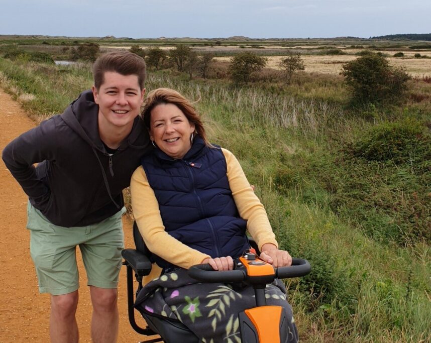 Phil Bailey with his late mother in a mobility scooter in the countryside