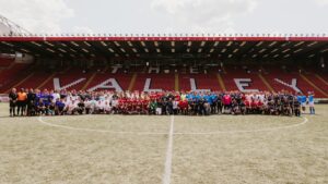 The Microsoft UK Partner Championship teams gathered for a group photo at the Valley, Charlton Athletic FC's ground