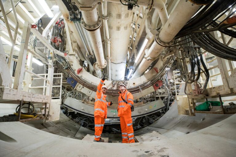 Balfour Beatty engineers discussing within an HS2 rail tunnel
