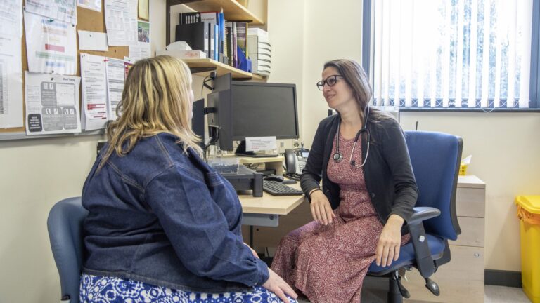Doctor consulting with patient