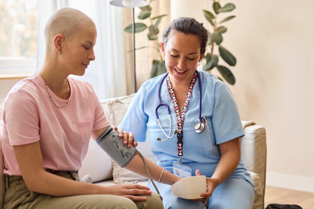 Nurse taking patient's blood pressure