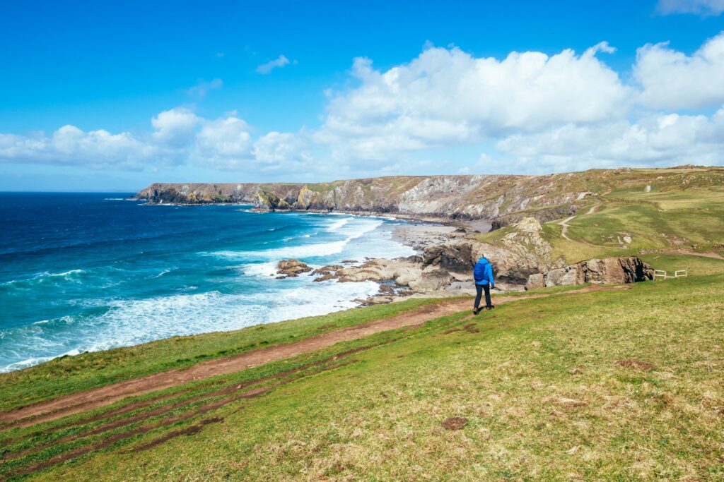Rambler walking along Cornish coastal path