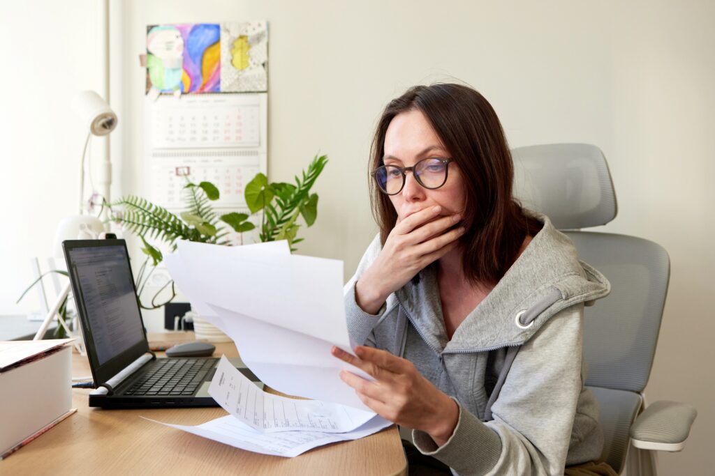 Self employed woman struggling to understand bills and tax