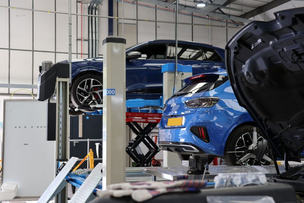 Cars being serviced in a garage