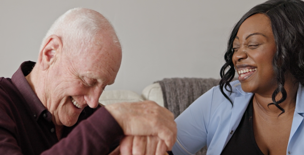 Elderly Man & Care Giver Laughing