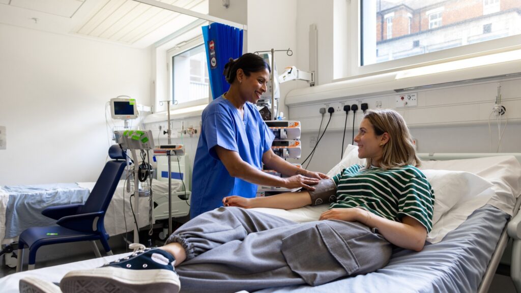 Nurse taking patient's blood pressure