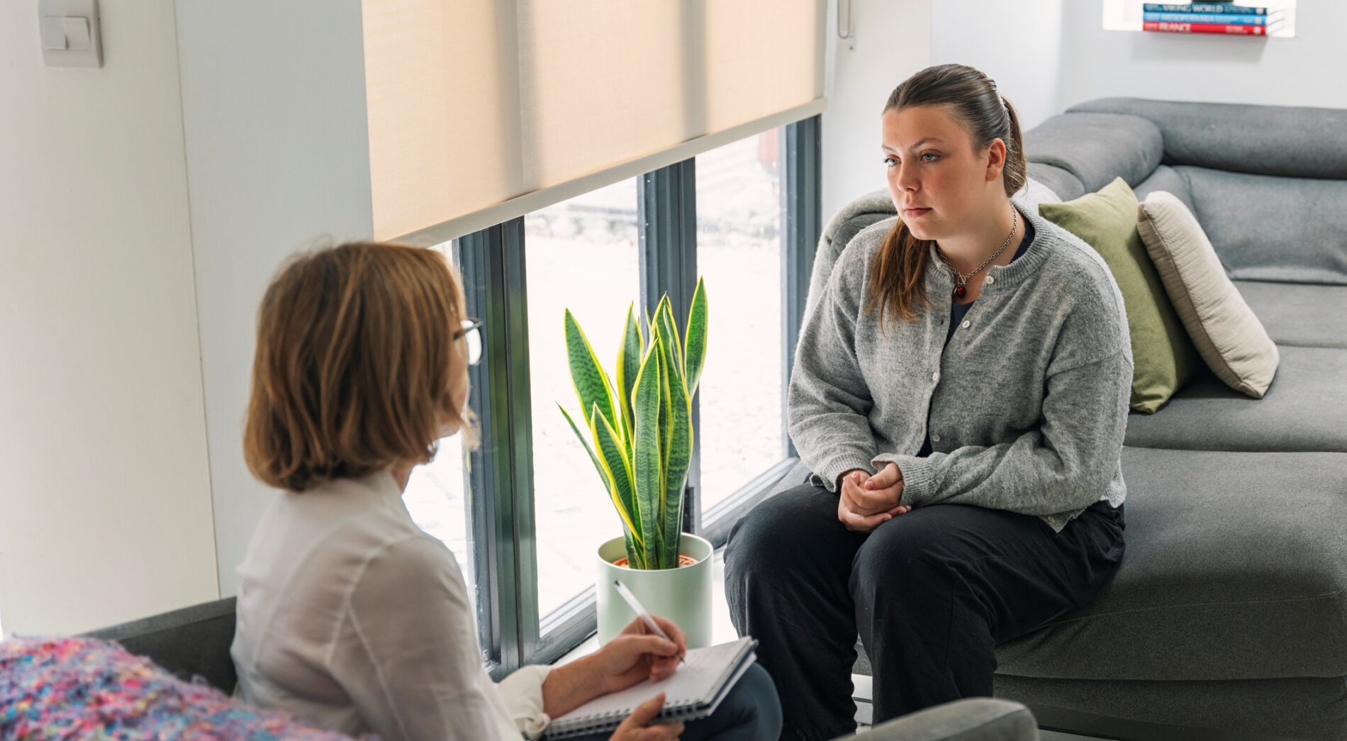 Social worker interviewing young woman